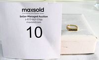 Ring beside MaxSold lot card showing overall appearance and rectangular Greek key design