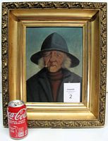 Frontal view of framed oil painting with soda can for scale