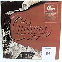 Front cover showing Chicago X artwork and sticker with song titles