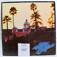 Front cover of Hotel California gatefold jacket with palm tree artwork and catalogue sticker visible