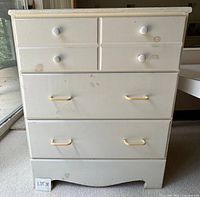 Front view of dresser showing drawers and hardware
