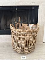 Basket with tools in front of fireplace