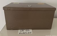 Front view of brown steel lockbox with size card