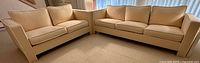 Both sofas arranged in L-shape to show matching design and upholstery