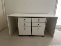 Front view of desk with two pedestals beneath