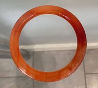 Full view of orange-red stone bangle