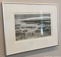 Framed etching on wall showing full view