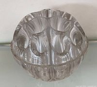 Front view of clear glass flower frog