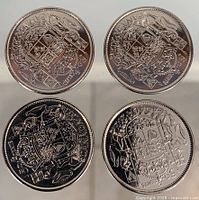 Four 2003 Canadian 50-cent coins, reverse side showing coat of arms