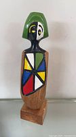 Full view of painted wood figure front