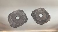 Both metal 45 rpm adapters front view showing embossed Webster-Chicago lettering