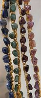 Four gemstone chip bracelets on gold-tone chains