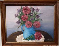 Front view of framed floral oil painting