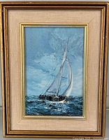 Full view of framed sailboat painting