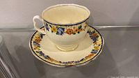 Cup front and saucer display showing pattern