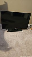 Front view of Samsung 32" TV on stand
