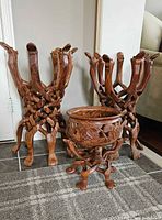 Two opened camel head folding stands and a sample bowl in front