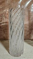 Full view of clear crystal cylinder vase with frosted spiral cuts