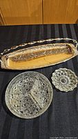 All three items grouped: silver plated tray, round glass relish tray, small glass condiment dish