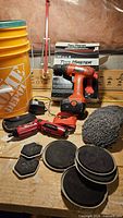 Full lot showing bucket, drill, driver, movers, knit pad