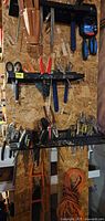 Wall organizers filled with assorted hand tools
