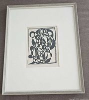Framed woodcut print full view showing frame, mat and image