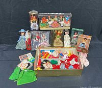Full lot showing dolls in various packages, Skipper doll, clothing box