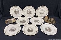 Group shot of eight Wedgwood plates and four silver-plated items