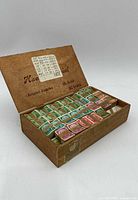 open wooden cigar box with bundled German stamps