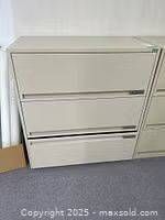 Front view of beige 3-drawer lateral filing cabinet