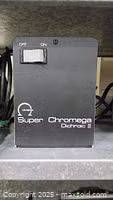 Front view of Omega Super Chromega Dichroic II power supply showing branding and power switch