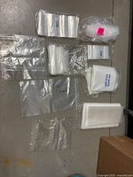 Overview of all plastic bag bundles laid out on floor