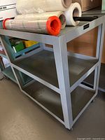 Full view of cart with three shelves and recessed top shelf