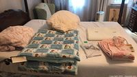 All six bedding items laid on bed