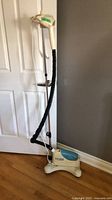 Full view of Tobi upright clothes steamer showing pole, hose, steam head and base