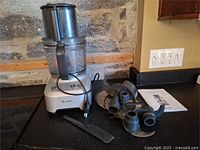 Complete food processor with accessories laid out
