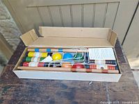 Box open showing full croquet set components
