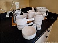 All items grouped on countertop showing overall lot contents