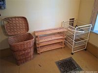 Overall shot of basket, shoe rack, and rolling cart