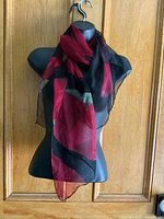 Scarf draped on mannequin showing size, colors and transparency