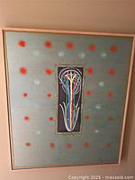 Full view of framed abstract painting on wall