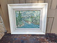 Frontal view of framed oil painting