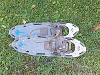 Full view of both snowshoes showing frame, decking and bindings