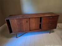 Front full view showing drawers, sliding doors, legs