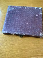 closed maroon presentation case