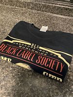T-shirt folded showing tag and partial graphic