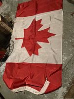 Full view of large Canadian flag laid flat
