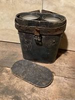 Binocular case front view with detached lid