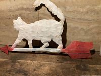 full view of tin cat weathervane on arrow