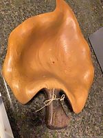 Top view of leaf-shaped wooden bowl showing overall form and stem